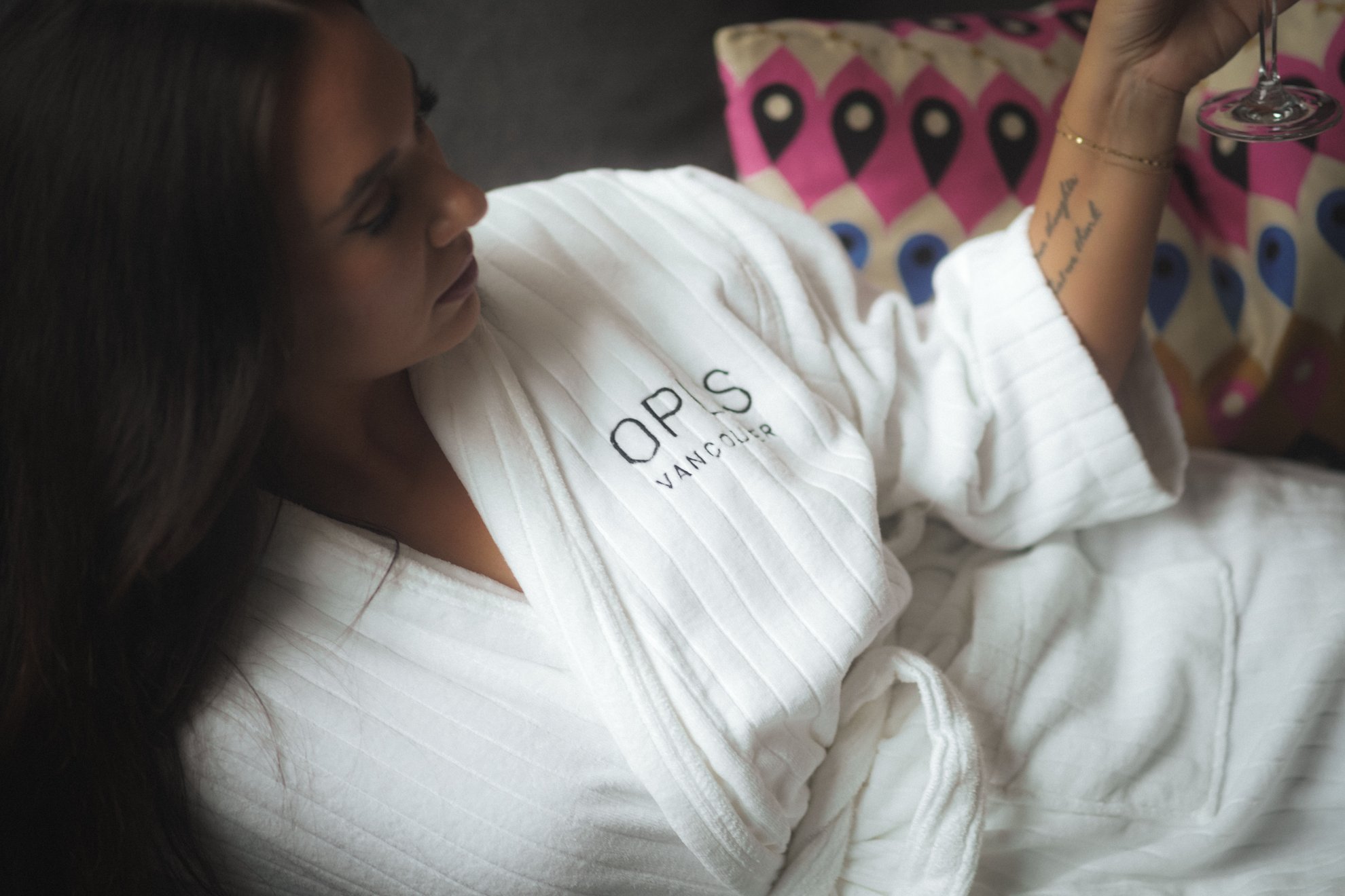 girl lounging on the couch in a robe