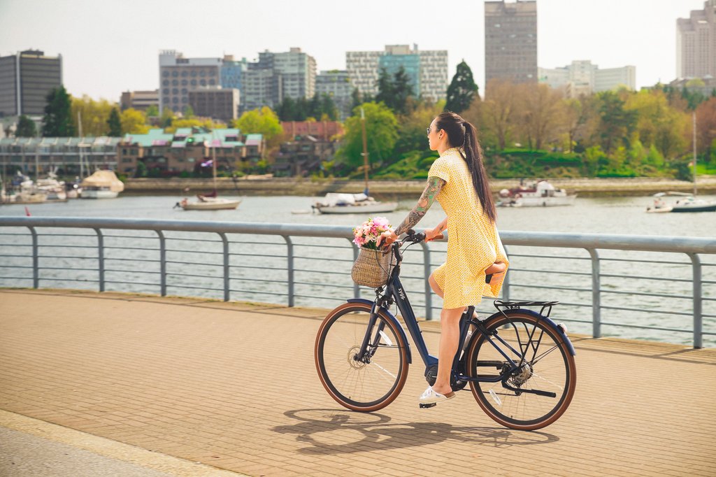 girl_riding_ebike_along_vancouver_seawall